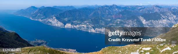 panoramic view of lake in mountains - krzysztof turek stock-fotos und bilder