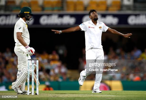 Suranga Lakmal of Sri Lanka celebrates after taking the wicket of Joe Burns of Australia during day one of the First Test match between Australia and...