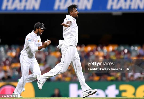 Suranga Lakmal of Sri Lanka celebrates taking the wicket of Joe Burns of Australia during day one of the First Test match between Australia and Sri...