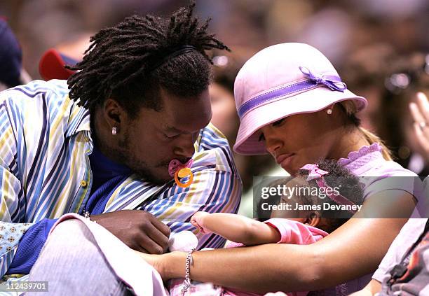 LaVar Arrington and Trishia Johnson with daughter during Celebrities Attend Miami Heat vs New Jersey Nets Playoff Game - May 14, 2006 at Continental...