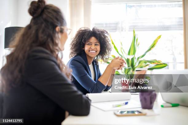 woman in meeting with coworker at start up office - business phone meeting stock pictures, royalty-free photos & images