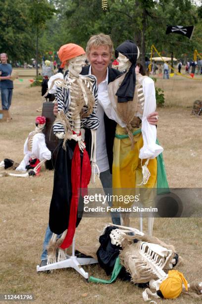 Michael McKell and his sons during "Peter Pan" Characters Wander Kensington Gardens for Great Ormond Street Hospital - July 23, 2005 at Kensington...