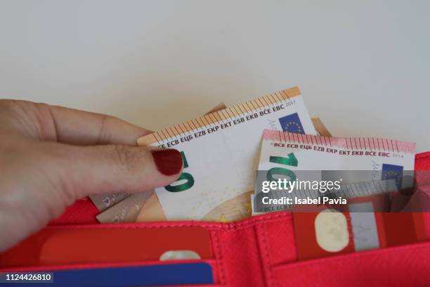 woman hand taking euro notes from wallet - european union euro note stock pictures, royalty-free photos & images