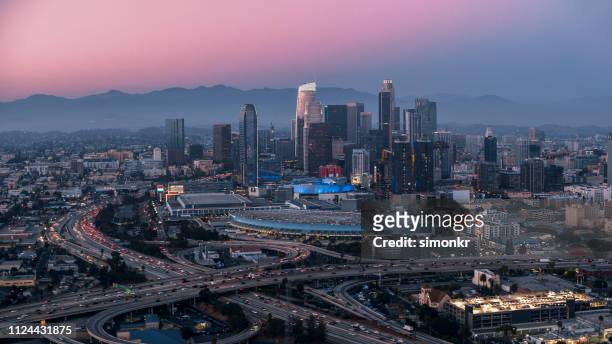 view of modern crowded cityscape - los angeles convention center stock pictures, royalty-free photos & images