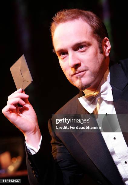 Derren Brown poses for a photocall for his "Darren Brown Mind Reader: An Evening of Wonders" at the Garrick Theatre on May 6, 2008 in London, England.