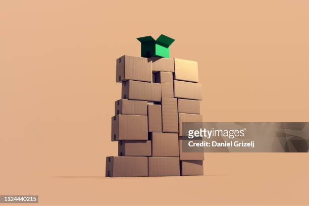A large pile of cardboard boxes stacked on top of each other