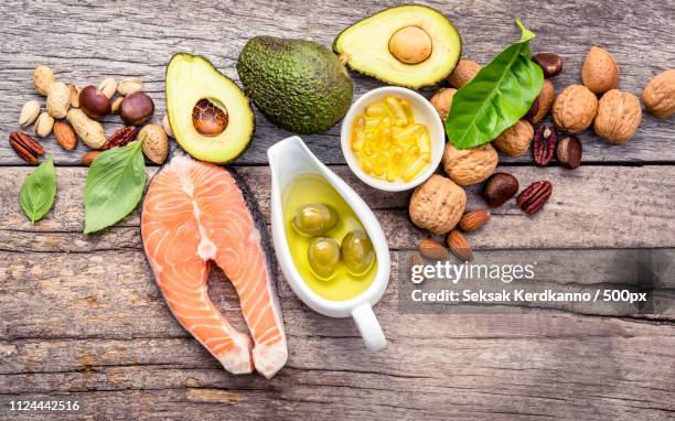 selection food sources of omega 3 and unsaturated fats on shabby - vitamin b stockfoto's en -beelden