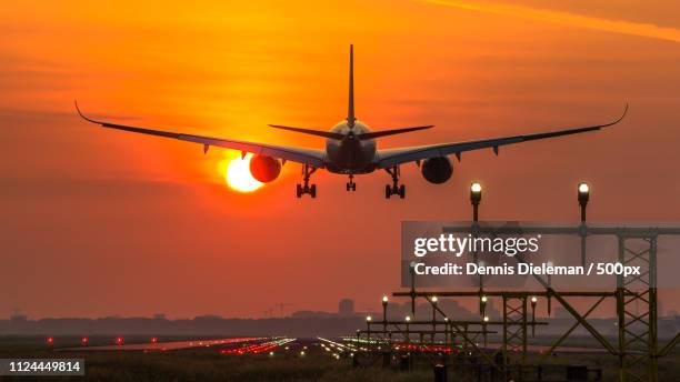 airbus 350 landing at schiphol airport. - amsterdam schiphol airport stock pictures, royalty-free photos & images
