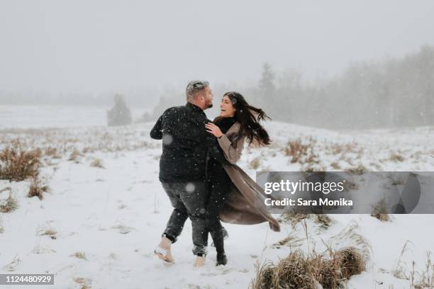 couple dancing in snowy landscape, georgetown, canada - young couple dancing stock pictures, royalty-free photos & images