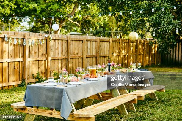 place setting on dining table in back yard - table garden bildbanksfoton och bilder