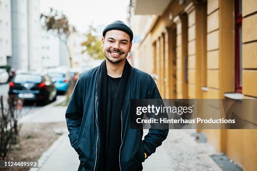 Portrait Of Young Man Smiling In City Street Portrait Of Young Man Smiling In City Street