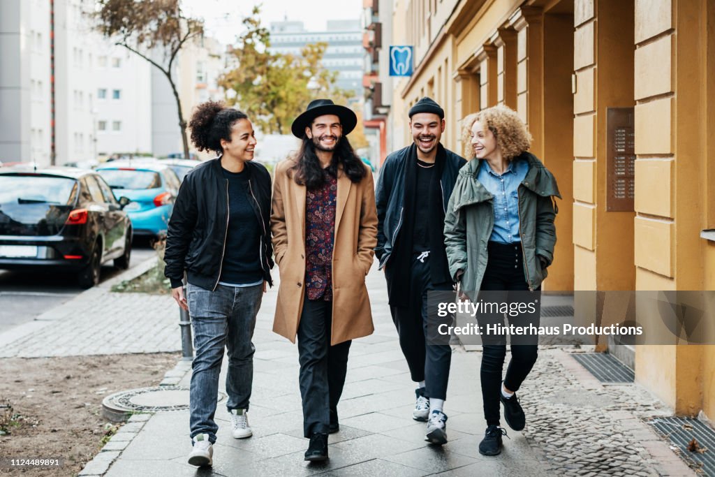 Group Of Friends Making Way To A Bar