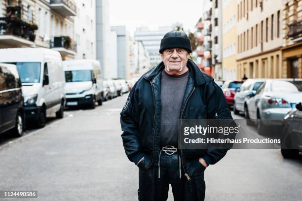 portrait of mature man wearing bomber jacket - city 70's fotografías e imágenes de stock