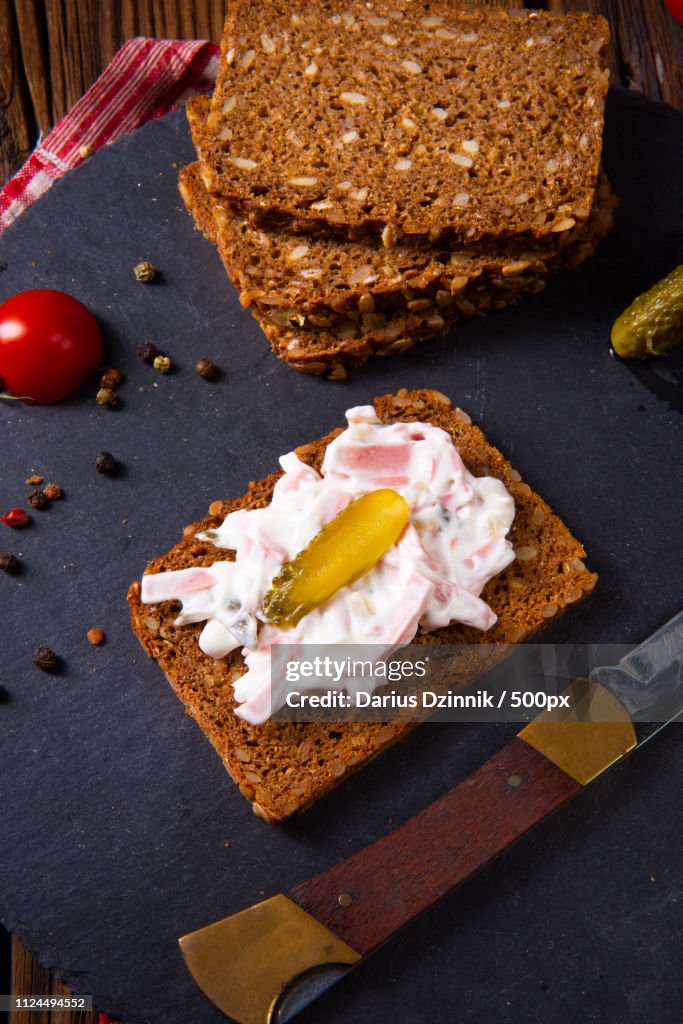 Delicious Spicy Meat Salad With Cucumber On The Black Bread