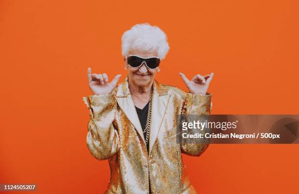 grandmother portraits on colored backgrounds - glamour woman stock pictures, royalty-free photos & images