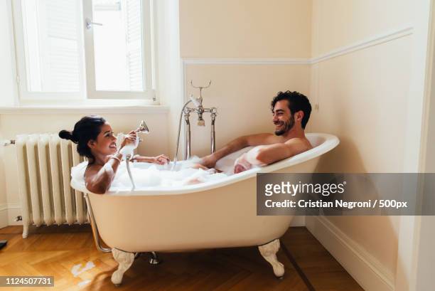 couple in love spending time together in the house. romantic mom - couple and kiss and bathroom stock-fotos und bilder