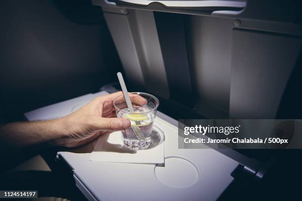 refreshing drink on plane - airplane food stock-fotos und bilder