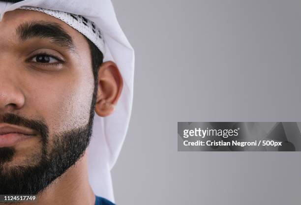 arabic handsome man studio portraits - emirati face smile fotografías e imágenes de stock
