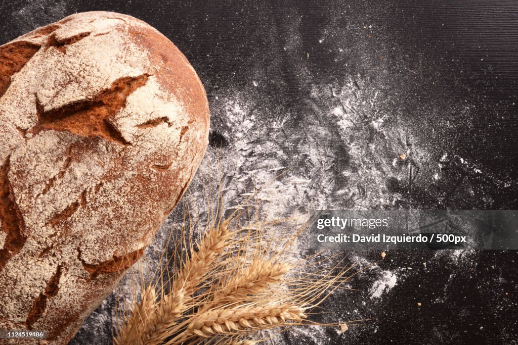 Rustic Bread On A Black Table Top View