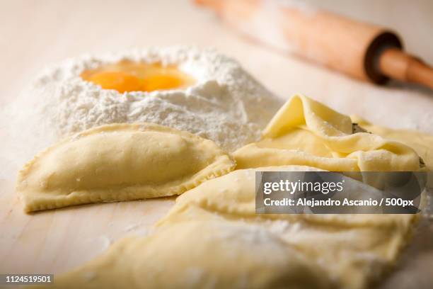 flour and dumplings on making table - alejandro ascanio stock-fotos und bilder