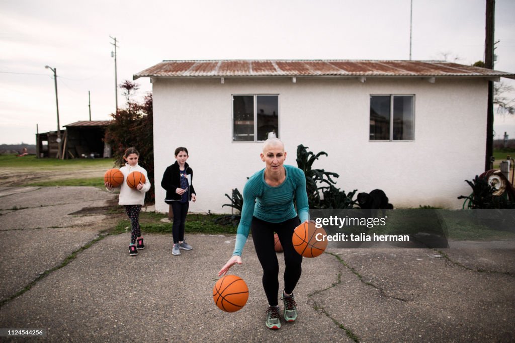 Bald mother basketball coach