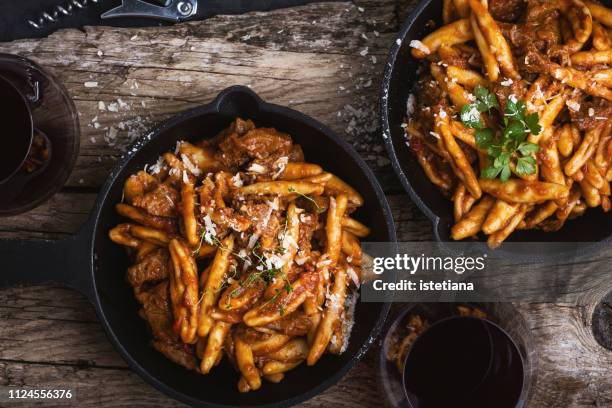 homemade pasta (casereccia) with beef ragu - cast iron stock pictures, royalty-free photos & images