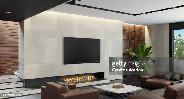 modern spacious minimalist living room with eco fireplace - insight tv stock pictures, royalty-free photos & images