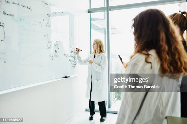 Person Writing Lab Notes Reference Guide Photos and Premium High Res Pictures - Getty Images