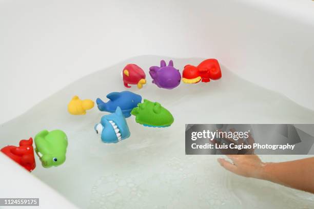 animals of plastic in the bath - baby bath toys stock pictures, royalty-free photos & images