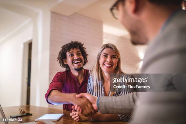 the agreement is made! - client handshake stock pictures, royalty-free photos & images