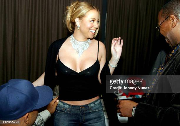 Russell Simmons, Mariah Carey and Andre Harrell during Sean "P. Diddy" Combs' Surprise 35th Birthday Party at Figa in New York City, New York, United...