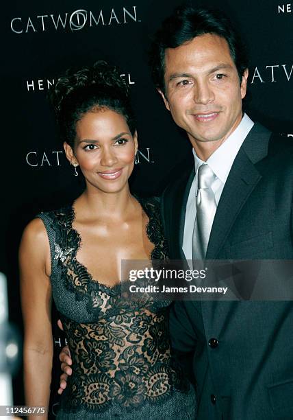 Halle Berry and Benjamin Bratt during Warner Bros. Consumer Products and Henri Bendel Host Purr-fect "Catwoman" at Henri Bendel in New York City, New...