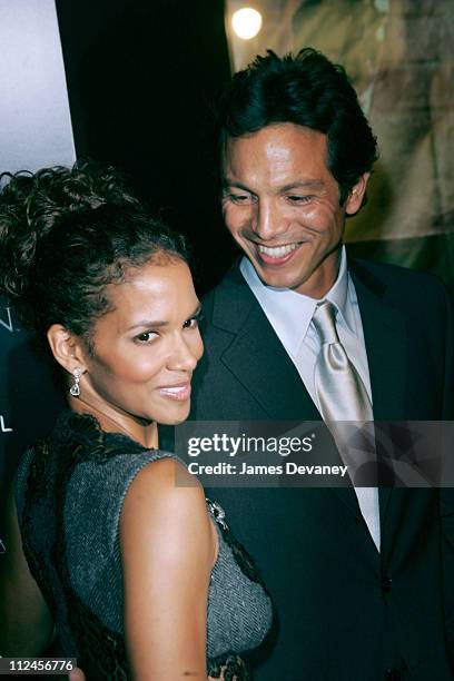 Halle Berry and Benjamin Bratt during Warner Bros. Consumer Products and Henri Bendel Host Purr-fect "Catwoman" at Henri Bendel in New York City, New...