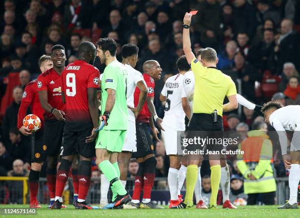 Paul Pogba of Manchester United receives a red card by referee Daniele Orsato of Italy while captain Ashley Young of Manchester United protests...