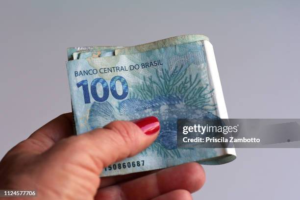female hand holding money - 100 stock pictures, royalty-free photos & images