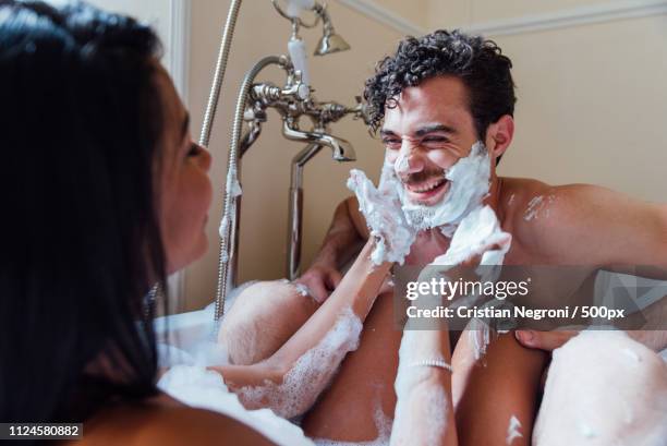 couple in love spending time together in the house. romantic mom - couple and kiss and bathroom stock-fotos und bilder