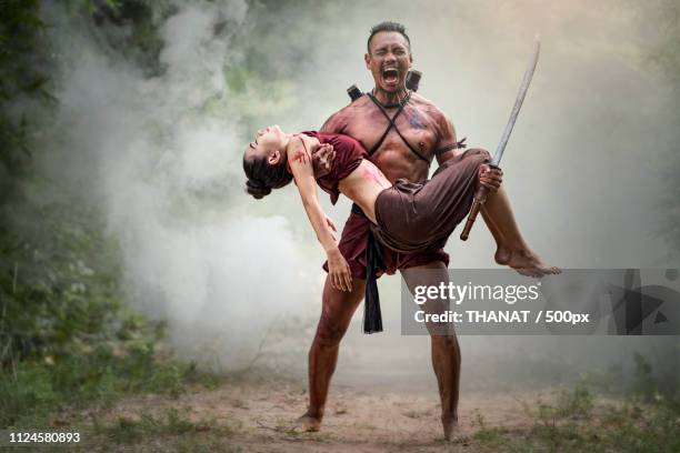 warrior screaming in grief while holding body of his love - ancient female warriors stock pictures, royalty-free photos & images