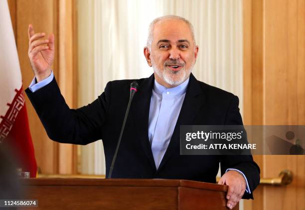 Iran's Foreign Minister Mohammad Javad Zarif gestures during a press conference in Tehran on February 13, 2019. - Zarif said that a 60-nation...