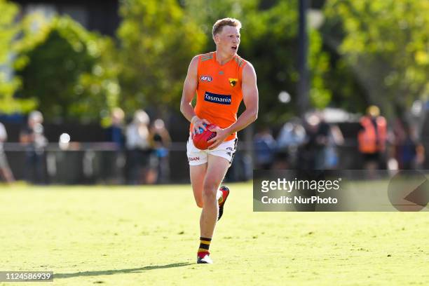 James Sicily of the Hawks runs with the ball during the Hawthorn Football Club AFL Intra Club match at Waverley Park on February 13 in Melbourne,...