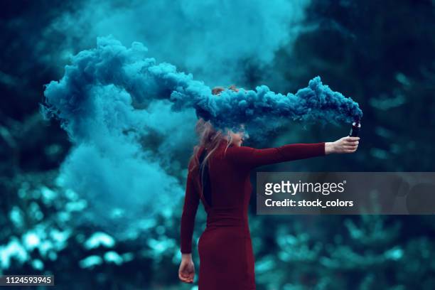 deep smoke from flaming torch - beautiful romanian women stock pictures, royalty-free photos & images