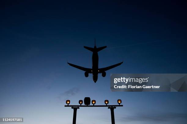 Landing plane is pictured near the Airport Tegel on February 12, 2019 in Berlin, Germany.