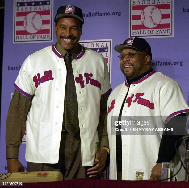 Dave Winfield and Kirby Puckett pose in their new jerseys after being introduced as the newest members of the National Baseball Hall of Fame during a...