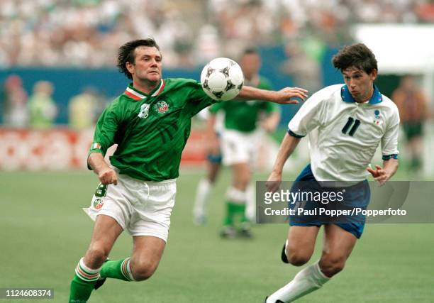 Ray Houghton of the Republic of Ireland and Demetrio Albertini of Italy battle for the ball during a 1994 FIFA World Cup Group E match at the Giants...