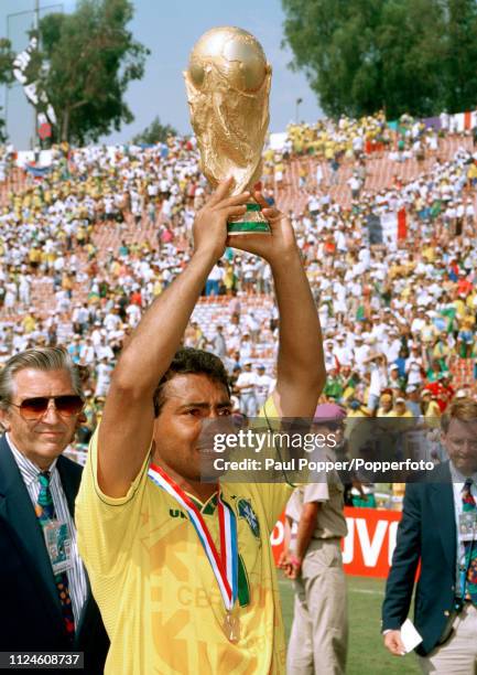 Romario of Brazil lifts the trophy after the 1994 FIFA World Cup Final between Brazil and Italy at the Rose Bowl on July 17, 1994 in Pasadena, United...