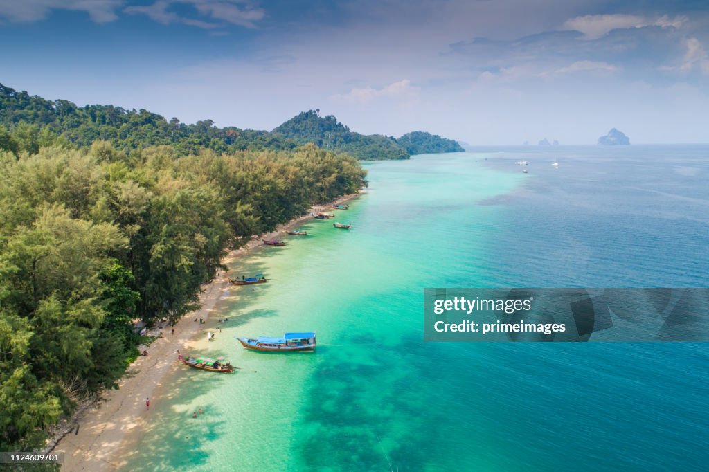 Aerial view shot tropical beautiful beach sea with mangrove forest in south thailand