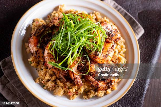 barbecue shrimp - cauliflower rice stock pictures, royalty-free photos & images