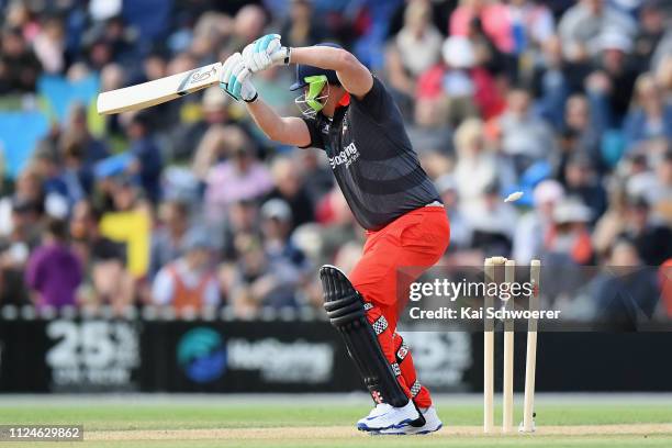 David Hussey of Team Rugby is bowled by James Franklin of Team Cricket during the New Zealand T20 Black Clash at Hagley Oval on January 25, 2019 in...