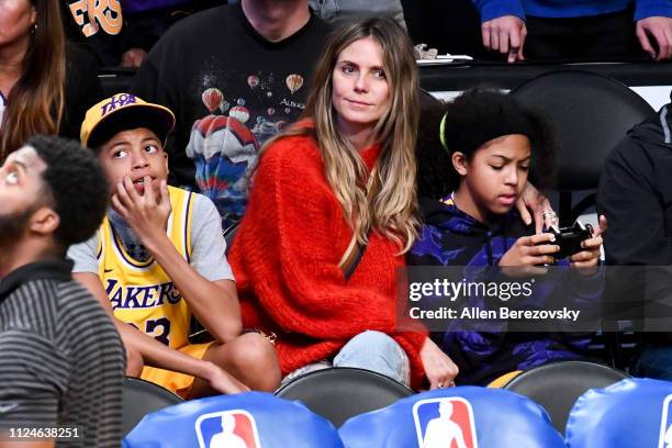 Heidi Klum and her kids Henry Samuel and Lou Samuel attend a basketball game between the Los Angeles Lakers and the Minnesota Timberwolves at Staples...