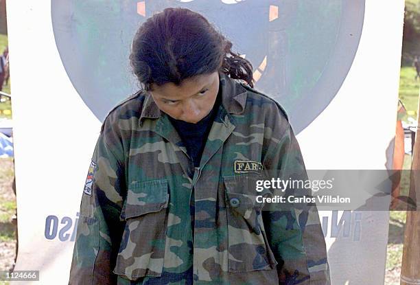 Thirteen year-old girl from the Revolutionary Armed Forces of Colombia, FARC, is held captive by the Colombian military July 12, 2002 in La Plata,...