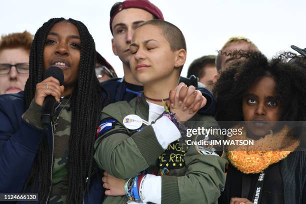 In this file photo taken on March 24, 2018 Marjory Stoneman Douglas High School student Emma Gonzalez listens with other students during the March...